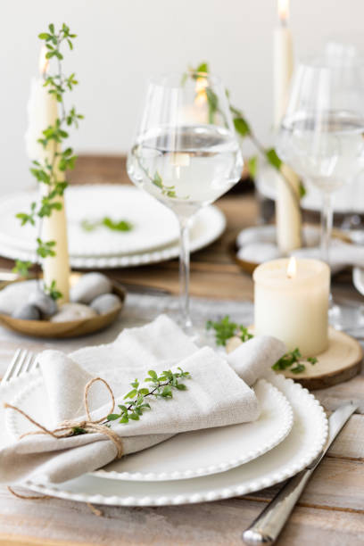 istock Rustic zero waste wedding decor with natural elements. Wooden table, candles, linen napkins, branches with green leaves. Eco-friendly decoration for the special dinner. Romantic and cozy place 1396186269