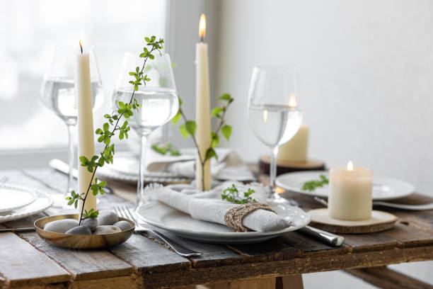 istock Rustic zero waste wedding decor with natural elements. Wooden table, candles, linen napkins, branches with green leaves. Eco-friendly decoration for the special dinner. Romantic and cozy place 1396186411