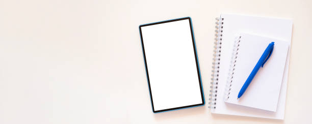 istock Banner with planner, notebook and blue pen lie near teblet 1396189537