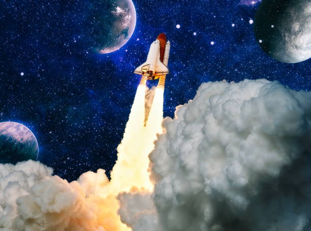 istock shuttle launch in the clouds to outer space. Dark space with stars on background.Spaceship flight. Elements of this image furnished by NASA 1396190547