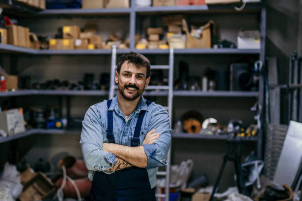 istock Confident mechanic at his workshop factory 1396193130