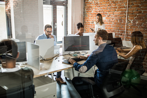 Large Group Of Computer Programmers Working In The Office Stock Photo ...
