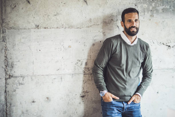 istock Happy male entrepreneur against the wall. 1396197769
