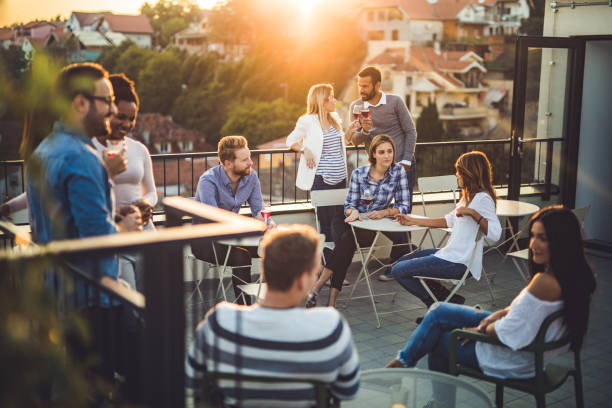 istock Large group of happy business people having fun on a balcony after work. 1396197862