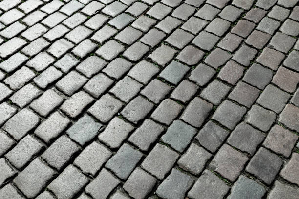 istock pattern of old cobblestone paved street 1396199687