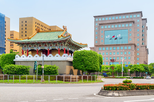 Taipei, Taiwan - April 23, 2019: Scenic colorful view of the East Gate and modern buildings. Traditional Chinese architecture. Awesome cityscape. Taipei is a popular tourist destination of Asia.