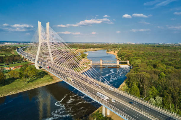 istock Large bridge over river with cars traffic 1396201021