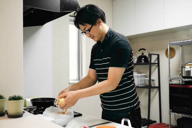 istock Mid adult man cooking in the domestic kitchen 1396201250