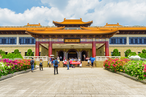 Kaohsiung, Taiwan - April 29, 2019: Entrance to the Fo Guang Shan Buddha Museum. Group of tourists taking pictures. Taiwan is a popular tourist destination of Asia.