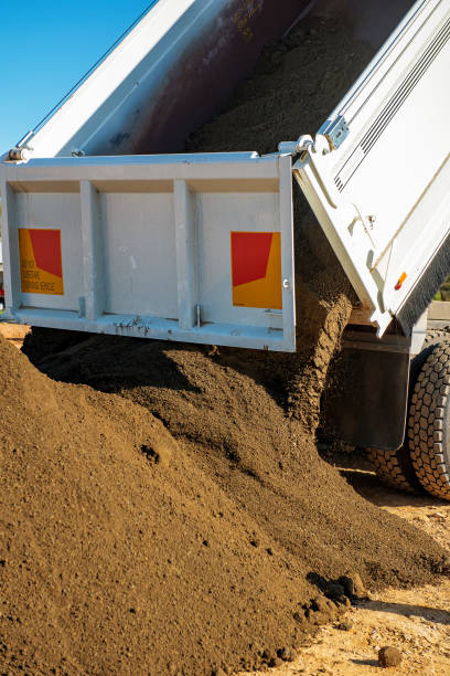 istock Truck and Trailer dumping gravel 1396202085