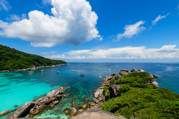 istock Panoramic view of Koh.8 Similan Island with white cloud and blue sky and clear water. 1396202111