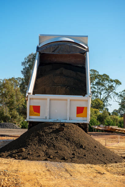 istock Truck and Trailer dumping gravel 1396202184