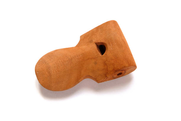 Traditional samba apito whistle isolated on a white background