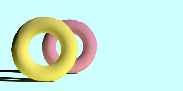 istock Two inflatable rings on turquoise summer background 1396205539