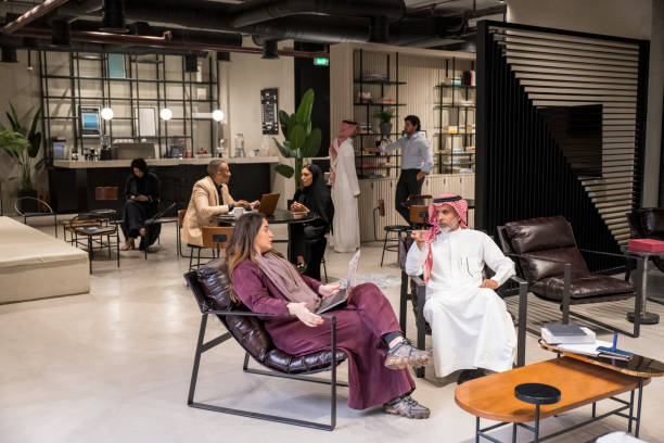 Saudi business people meeting in coworking office lounge