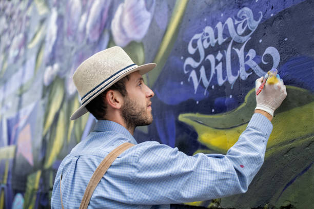 Graffiti Artist Signing His Drawn Wall
