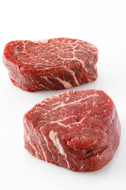istock Close-up view of filet mignon isolated on white background 1396211325