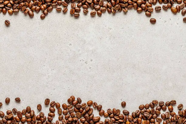 Photo of Coffee border over old liht stone background