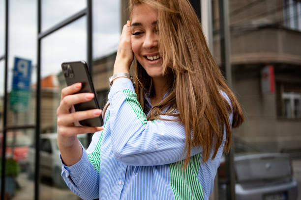 istock Bussinesswoman in financial district using smartphone and share information 1396213599