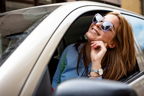 istock Young woman enjoying the car ride 1396213712