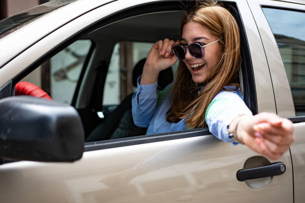 istock Young woman enjoying the car ride 1396213716