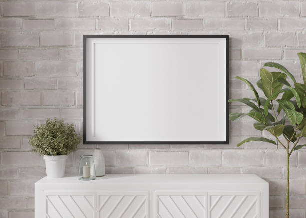 istock Empty horizontal picture frame on white brick wall in modern living room. Mock up interior in minimalist, contemporary style. Free space for your picture, poster. Console, candle, plant. 3D rendering. 1396213982
