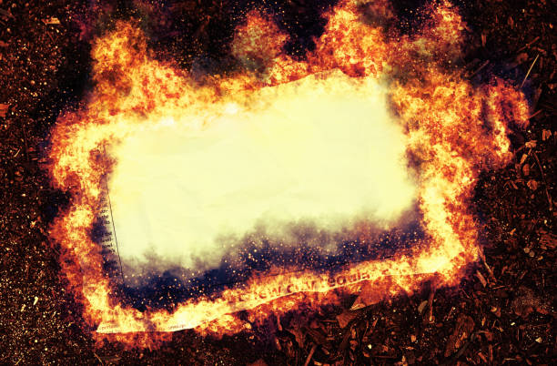 On fire, a piece of paper torn from a simulated newspaper, designed by the photographer and free of design copyright. Large blank area in which to insert your copy.