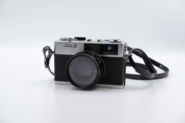 isolated white background beautiful vintage analog rangefinder film camera. 70's decade film camera. front view image. - rangefinder camera imagens e fotografias de stock