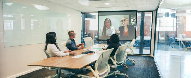 istock Modern businesspeople having a virtual briefing in a boardroom 1396216516