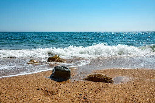 Sunny beach with golden sands blue sky and azure sea