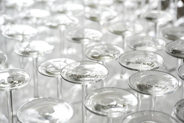 Many wine glasses set upside down for a food and drink event, full frame background, copy space, selected focus, narrow depth of field