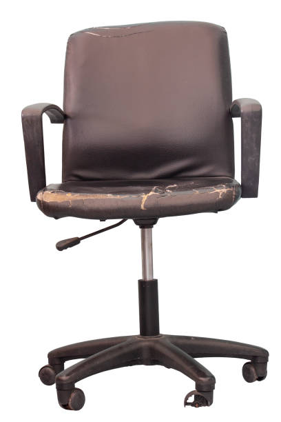 istock Damaged black leather office chair isolated on white background with clipping path. 1396217134