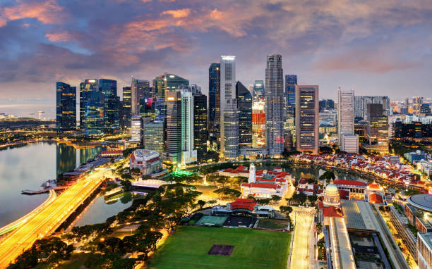 istock Singapore skyline city at sunset 1396217699