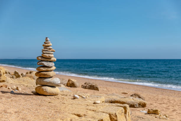 Cairn Stones stacked by the beach