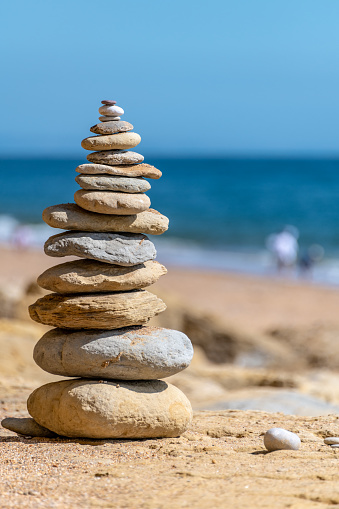 Vertical Cairn Stones stacked by the beach