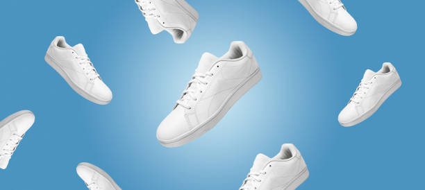 istock Banner with pattern of white sneakers isolated on blue background. 1396220270