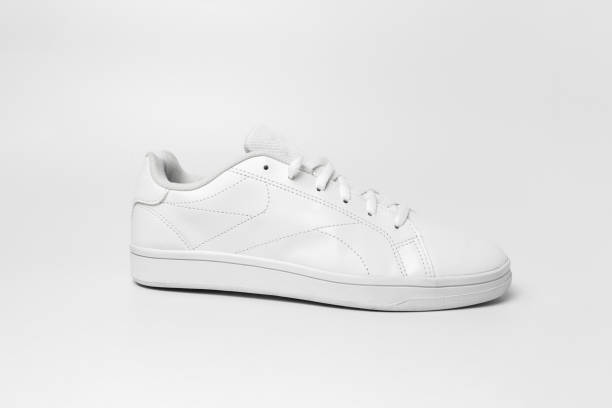 istock Side view of white sneaker isolated on white background for cutting out. 1396220272