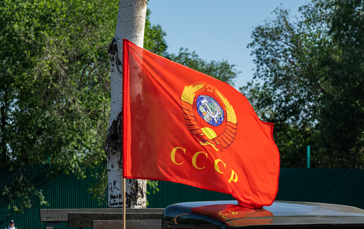 Waving flag of Soviet Union with emblems