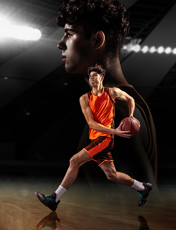Composite image with young male basketball player with ball over dark background with reflection effect. Concept of healthy lifestyle, competition, achievements, goals, hobby and ad.
