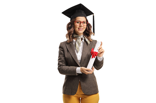 Bachelor female student with a graduation hat holding a diploma isolated on white background