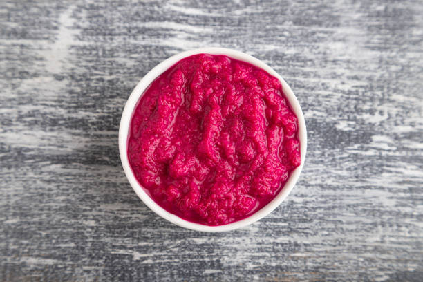 istock ceramic sauce bowl with, horseradish on a gray. Top view, copy space. 1396231027
