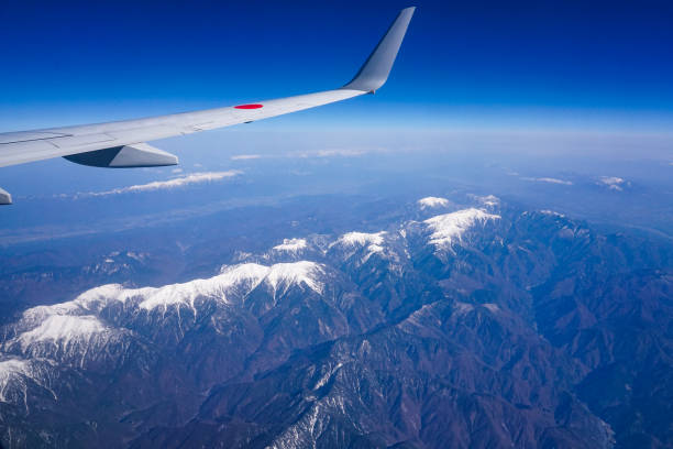 Overlooking the Akaishi Mountains, also known as the Southern Alps, from an airplane On a sunny day in April 2022, I photographed the Akaishi Mountains in the Southern Alps from the window of an airplane heading from Haneda Airport to Kitakyushu Airport. akaishi mountains stock pictures, royalty-free photos & images