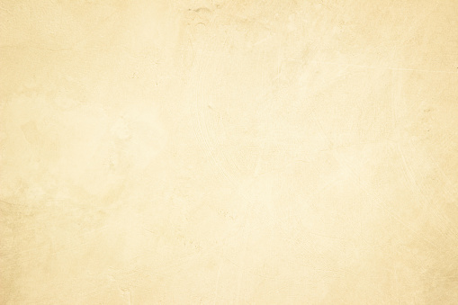 Old concrete wall texture background. Close up retro plain cream color cement material surface rough for show or advertise promote product content on display and brown paper design element concept.