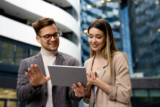 istock Two creative business people working on social media strategy using a digital tablet 1396234405
