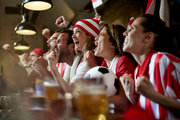 istock Celebrating the soccer victory in a pub! 1396234515