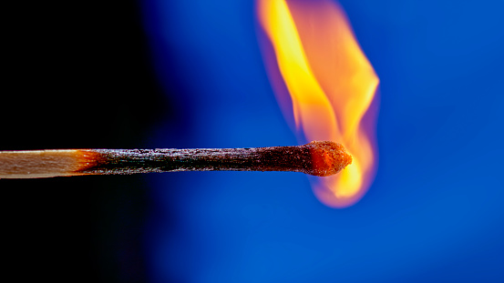 Lit Match With Flame on White Background