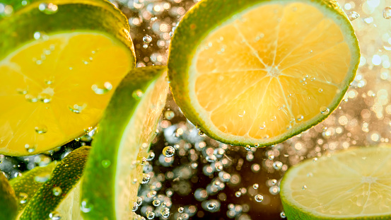 Close-up of lime slices in water.