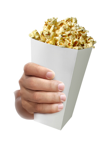 hand with Popcorn, in hand isolated on white background