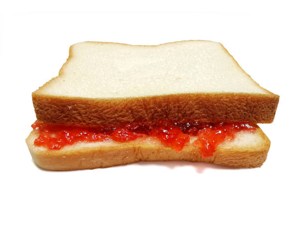 istock slice of bread with strawberry jam isolated on white 1396244412