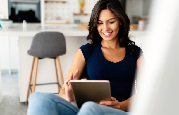 istock Beautiful student woman learning online on computer at home. Technology, education concept 1396244481
